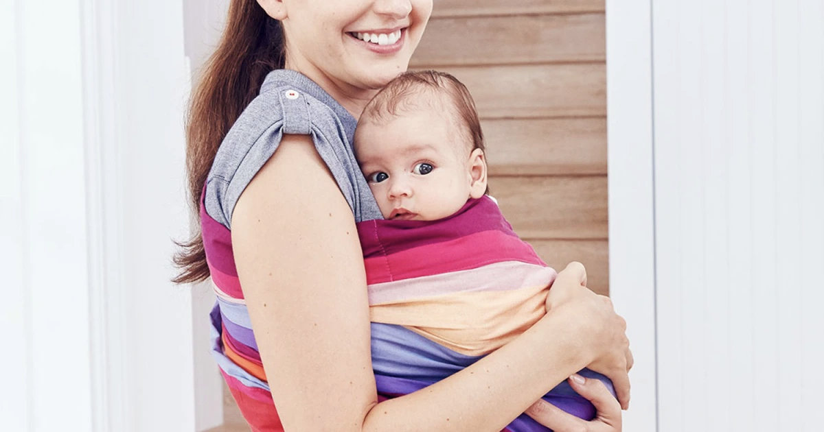 Mother holding baby in a sling