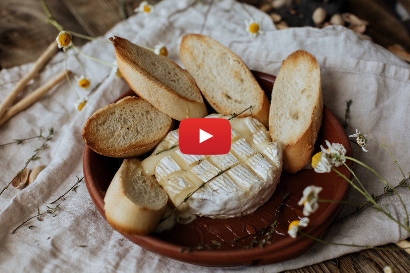 Cut up break with camembert cheese in a bowl